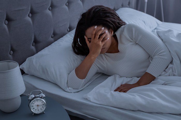 Une personne avec un sommeil perturbé